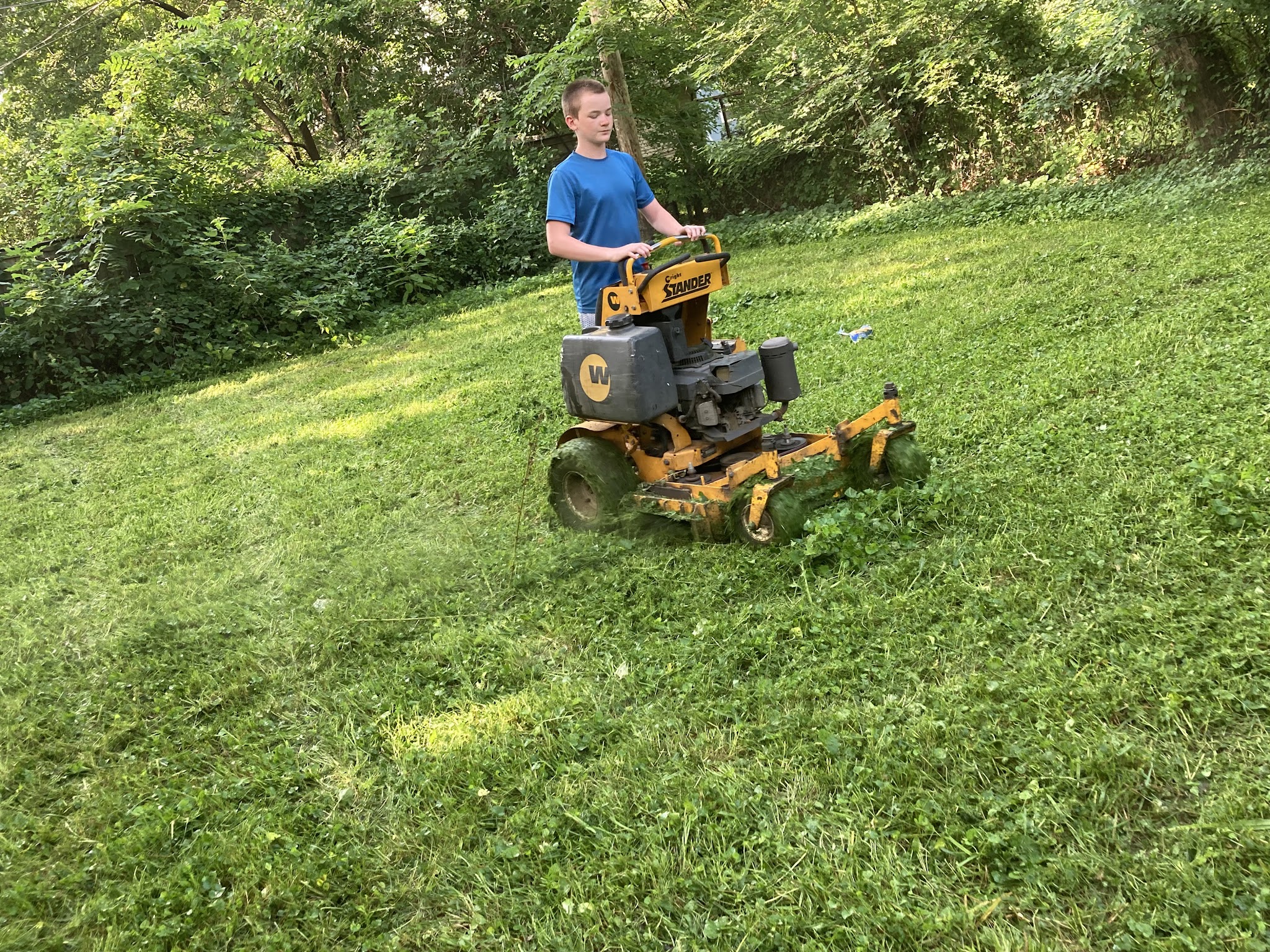 Mowing an overgrown slope on a stand-on mower